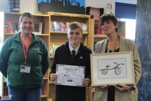 Photo of winning student with Mrs Cross and Sam Turner from Sustrans. 
